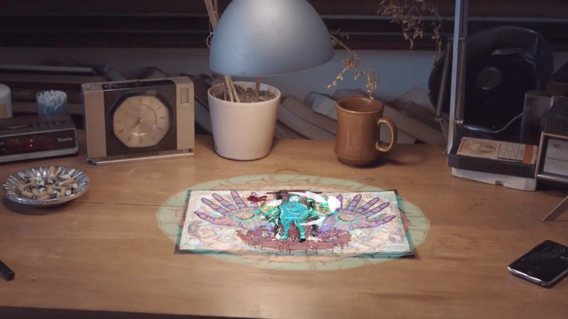 Interactive Storytelling - Polaxis comic page on a cluttered desk with clock radio, lamp and mug, an AR scene rising from the printed page